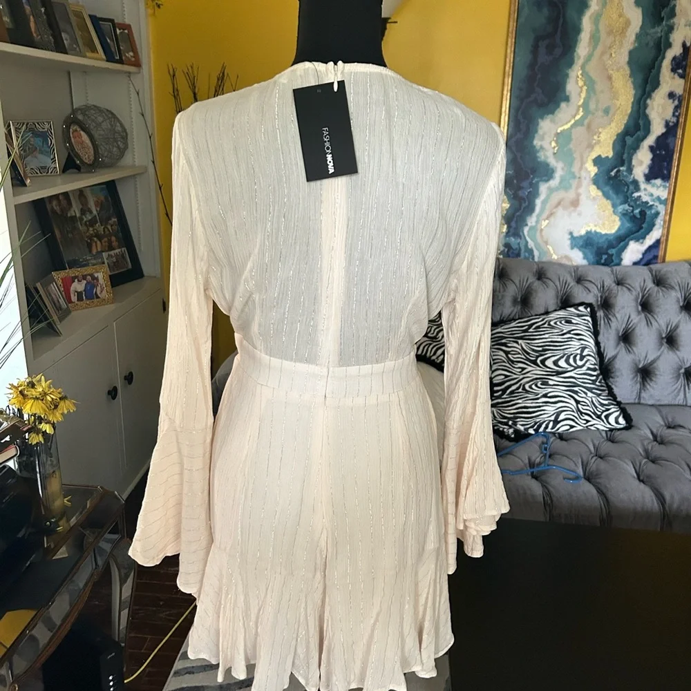 Fashion Nova cream with silver stripes short set zip up back. Plunging neckline.